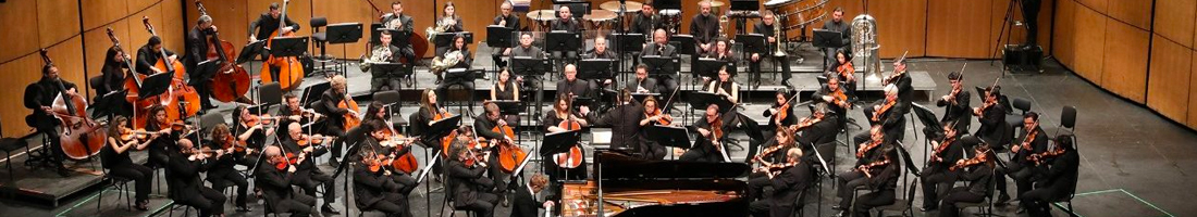 Foto general de la Orquesta Filarmónica de Bogotá en un auditorio