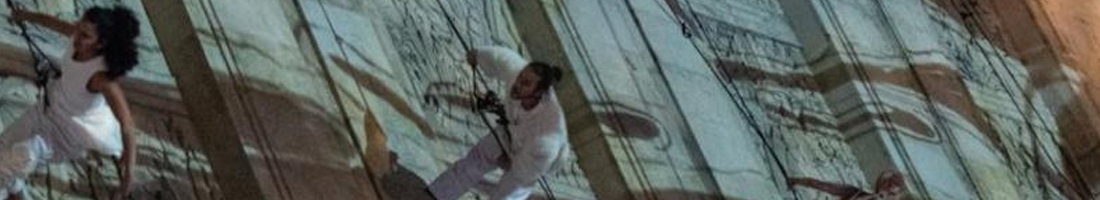 personas suspendidas en la pared aerodanza