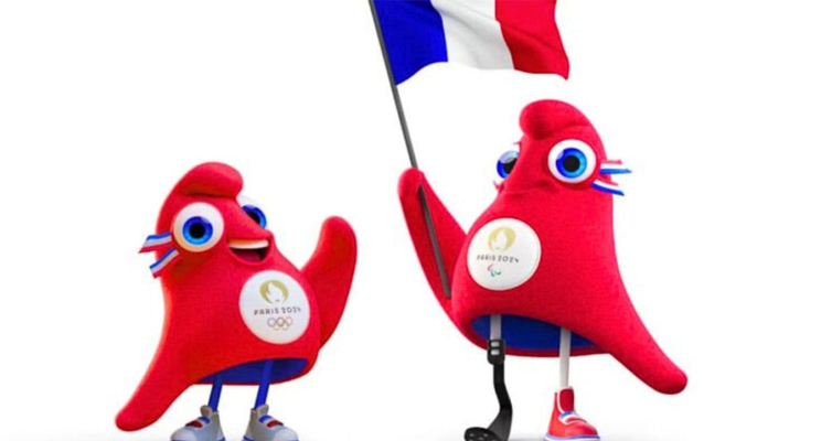 Mascotas juegos paralímpicos con bandera de Francia en la mano